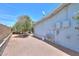 The backyard featuring gravel landscaping and mature trees at 5228 E Des Moines St, Mesa, AZ 85205