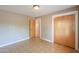 Bedroom with wood-look floors, and closet at 5228 E Des Moines St, Mesa, AZ 85205