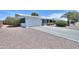 Single-story home with a two-car garage, driveway, and beautiful desert landscaping at 5228 E Des Moines St, Mesa, AZ 85205