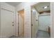 Hallway with three doors leading to other rooms at 5228 E Des Moines St, Mesa, AZ 85205