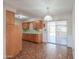 The kitchen is equipped with wooden cabinets and access to the backyard through a sliding door at 5228 E Des Moines St, Mesa, AZ 85205