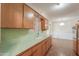 The kitchen offers ample countertop space and wooden cabinets at 5228 E Des Moines St, Mesa, AZ 85205