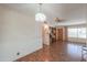 The living room is well-lit with a decorative ceiling fan and overhead lighting at 5228 E Des Moines St, Mesa, AZ 85205