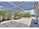 A covered patio area featuring desert landscaping and mature trees at 5228 E Des Moines St, Mesa, AZ 85205