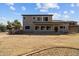 The home's backyard has a large lawn, covered patio, and built-in outdoor kitchen, perfect for relaxing or entertaining at 5402 S 54Th Ln, Laveen, AZ 85339