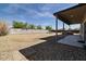 Enjoy outdoor living with a covered patio and ample yard space, perfect for outdoor relaxation and entertainment at 5402 S 54Th Ln, Laveen, AZ 85339