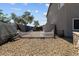Spacious backyard with gravel, partial fencing, and ample room for outdoor activities at 5402 S 54Th Ln, Laveen, AZ 85339