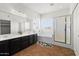 Bright bathroom with double vanity, tiled floors, soaking tub and glass enclosed shower at 5402 S 54Th Ln, Laveen, AZ 85339