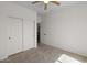 Bedroom with carpeted floor, large closets, and doorway to hallway at 5402 S 54Th Ln, Laveen, AZ 85339