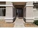 Front entrance with a security door and textured pillars, offering curb appeal at 5402 S 54Th Ln, Laveen, AZ 85339