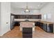 Stylish kitchen with stainless steel appliances and large island, perfect for cooking at 5402 S 54Th Ln, Laveen, AZ 85339