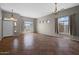 Bright, spacious living room with tiled flooring and elegant lighting fixtures at 5402 S 54Th Ln, Laveen, AZ 85339