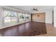 Inviting living room featuring herringbone flooring, large windows, and decorative lighting at 5402 S 54Th Ln, Laveen, AZ 85339