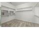 Walk-in closet with built in shelving, a carpeted floor, and plenty of storage space at 5402 S 54Th Ln, Laveen, AZ 85339