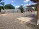 Spacious backyard featuring low maintenance landscaping and a covered patio area at 5702 E Casper Rd, Mesa, AZ 85205