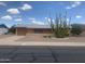 Single story home with desert landscaping featuring a large cactus in the front yard at 5702 E Casper Rd, Mesa, AZ 85205