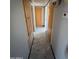 Hallway features neutral paint, marble floors, storage, and multiple bedroom access at 5702 E Casper Rd, Mesa, AZ 85205
