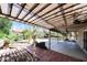 Relaxing backyard patio with covering, concrete and brick pavers, and a well-maintained yard at 6126 W Paradise Ln, Glendale, AZ 85306