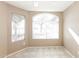 Cozy dining area with abundant natural light from windows, complemented by tile flooring at 6126 W Paradise Ln, Glendale, AZ 85306