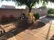 Outdoor seating area with brick pavers, garden accents, and privacy fence at 6334 E Albany St, Mesa, AZ 85205