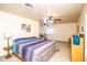 Spacious bedroom features neutral carpet, ceiling fans, and large furnishings at 6334 E Albany St, Mesa, AZ 85205