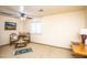 Bonus room area with neutral colored carpet, tea table and ceiling fan at 6334 E Albany St, Mesa, AZ 85205