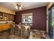 Cozy dining room with views to the backyard, stylish accents, and neutral lighting at 6334 E Albany St, Mesa, AZ 85205