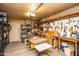 Spacious garage featuring storage, shelving, workbench area, and ample lighting at 6334 E Albany St, Mesa, AZ 85205
