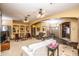 Open living room with carpet, tile flooring, ceiling fans, neutral paint, and designer accents at 6334 E Albany St, Mesa, AZ 85205