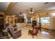 Expansive living area with a view into the open kitchen, large windows, and neutral interior at 6334 E Albany St, Mesa, AZ 85205