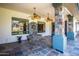 Covered patio with stone accents, ceiling fans, fountain feature, and shaded seating area at 6334 E Albany St, Mesa, AZ 85205