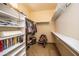 Walk-in closet with built-in shelving and plenty of storage space at 6334 E Albany St, Mesa, AZ 85205