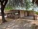 Exterior view of home featuring large yard, driveway, and unique architecture at 660 S 93Rd St, Mesa, AZ 85208