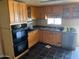 Kitchen boasts plentiful cabinets and countertop space and modern stainless steel appliances at 660 S 93Rd St, Mesa, AZ 85208