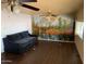 Living room featuring a ceiling fan, a scenic wall mural, and ample natural light at 660 S 93Rd St, Mesa, AZ 85208