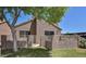 Backyard featuring gated access and lush green lawn at 7040 W Olive Ave # 94, Peoria, AZ 85345