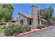 Beautiful home featuring a unique chimney design and mature flowering bushes at 7040 W Olive Ave # 94, Peoria, AZ 85345