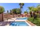 Community pool with palm trees, lounge chairs, and tables in a well maintained area at 7040 W Olive Ave # 94, Peoria, AZ 85345
