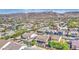 An aerial view showcases a Gathering friendly residential neighborhood and mountain views at 710 W Ardmore Rd, Phoenix, AZ 85041