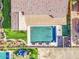 The backyard is seen from above, featuring a pristine pool with comfortable seating areas at 710 W Ardmore Rd, Phoenix, AZ 85041