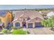 Stunning aerial view of a beautiful home with well-manicured lawn, tile roof, and two-car garage at 710 W Ardmore Rd, Phoenix, AZ 85041