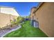 Well-maintained backyard with artificial grass and desert landscaping, enhancing the outdoor living space at 710 W Ardmore Rd, Phoenix, AZ 85041