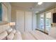 Bright bedroom with white bedding, sliding closet doors and glass doors to the patio at 710 W Ardmore Rd, Phoenix, AZ 85041