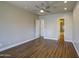 Clean bedroom with ceiling fan and ensuite bathroom at 710 W Ardmore Rd, Phoenix, AZ 85041
