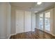 Bedroom with sliding closet doors and glass doors to the covered patio at 710 W Ardmore Rd, Phoenix, AZ 85041