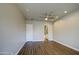 Spacious bedroom with a neutral color palette, ceiling fan, and ensuite bathroom at 710 W Ardmore Rd, Phoenix, AZ 85041