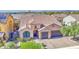 Beautiful single-Gathering home with a tile roof, manicured lawn, and a three-car garage at 710 W Ardmore Rd, Phoenix, AZ 85041