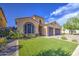 Attractive home with a three-car garage, well-kept lawn, and desert landscaping for easy maintenance at 710 W Ardmore Rd, Phoenix, AZ 85041