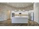Bright kitchen with white cabinets, stainless steel appliances, and a large center island at 710 W Ardmore Rd, Phoenix, AZ 85041