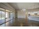 Spacious living room featuring tile floors, stone accent wall and sliding glass doors to outdoor living at 710 W Ardmore Rd, Phoenix, AZ 85041
